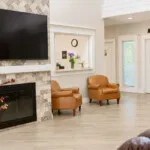Show photo 11: Living room fireplace at Barton House