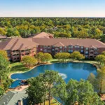 Show photo 5: Aerial view of the pond and campus at The Terraces at Kingwood