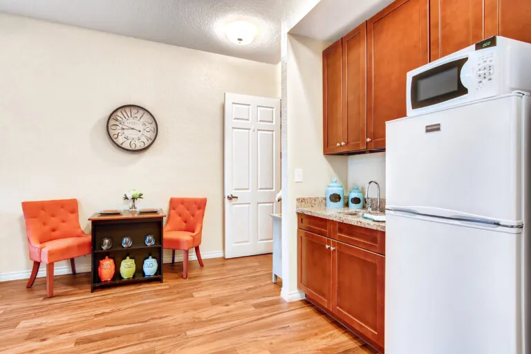 An apartment kitchenette and breakfast nook at The Terraces at Kingwood