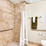 Show photo 115: A walk-in shower in an apartment at The Terraces at Kingwood