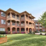 Show photo 2: Garden beds in front of the building at The Terraces at Kingwood