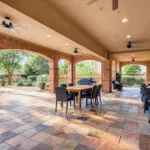 Show photo 18: The covered patio with brick arches at The Terraces at Kingwood
