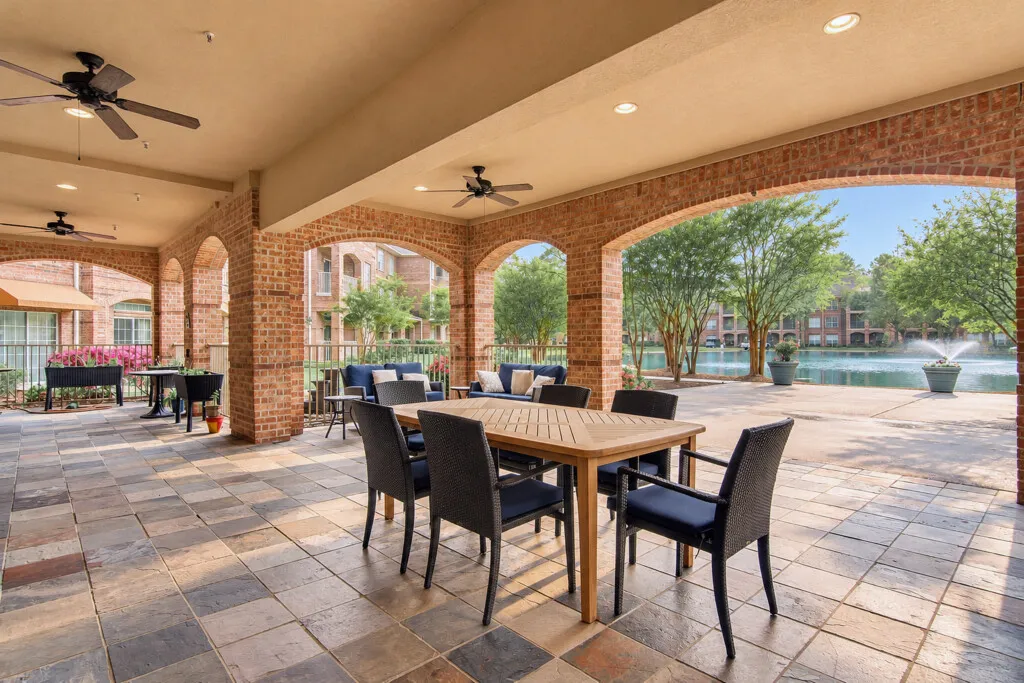 Dining tables on the covered patio at The Terraces at Kingwood