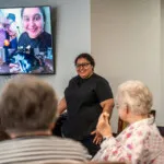 Show photo 108: A guest presenter visiting residents