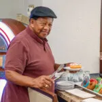 Show photo 49: A resident choosing dessert