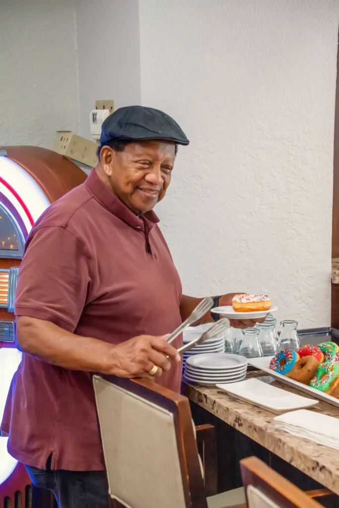 A resident choosing dessert