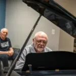 Show photo 98: A resident at the grand piano