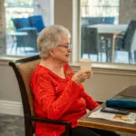 Show photo 39: A resident at lunch in the restaurant