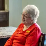 Show photo 107: A resident relaxing in the bistro