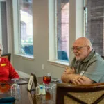 Show photo 36: Two residents enjoying lunch together
