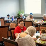 Show photo 96: Residents playing bingo in the activity room