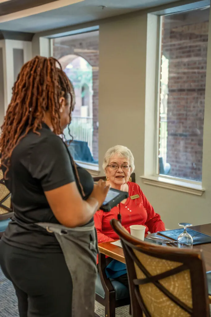 A server taking a resident's lunch order