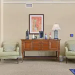 Show photo 28: Coffee station with a sideboard and two armchairs at Tarina of Cypresswood
