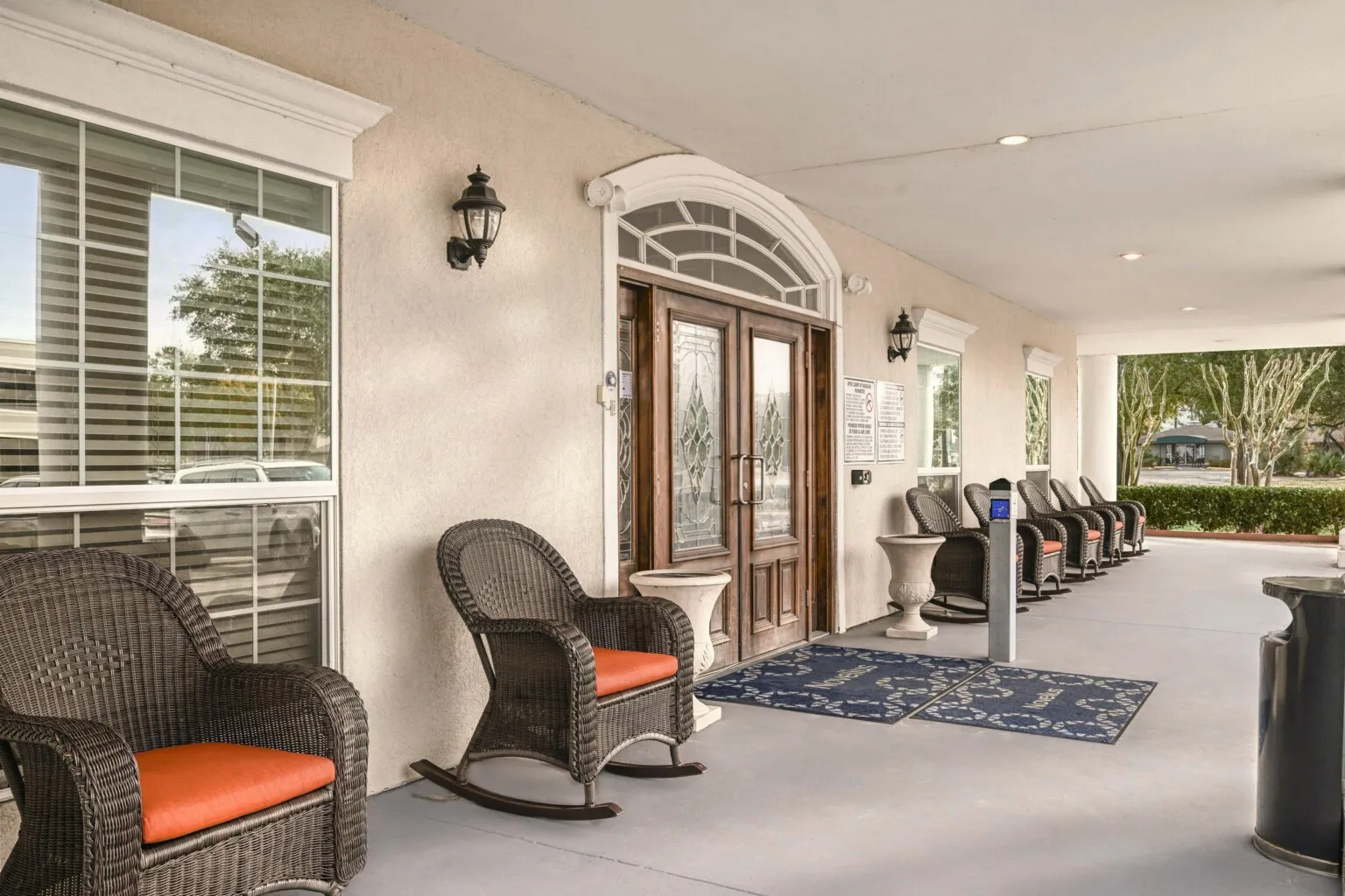 Covered front porch with rocking chairs at Tarina of Cypresswood