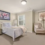 Show photo 30: Furnished residence bedroom with an armchair at Tarina of Cypresswood