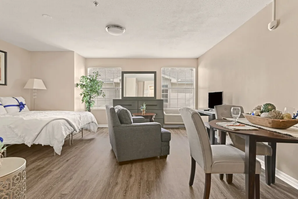 Furnished residence with a bed, sitting chair and dining table at Tarina of Cypresswood