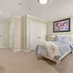 Show photo 32: Furnished residence with a bed, dresser and closet at Tarina of Cypresswood
