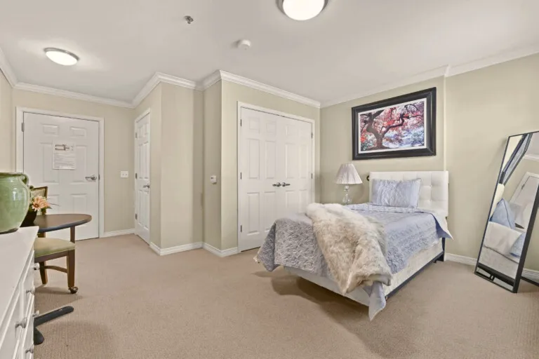 Furnished residence with a bed, dresser and closet at Tarina of Cypresswood