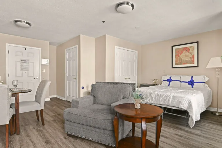 Residence sitting area with an armchair and side table at Tarina of Cypresswood