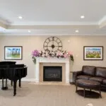 Show photo 14: Living room piano fireplace at Tarina of Kingwood