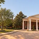 Show photo 1: The front portico at Tarina of Kingwood