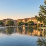 Show photo 6: The pond and fountain in front of The Terraces at Kingwood at sunset